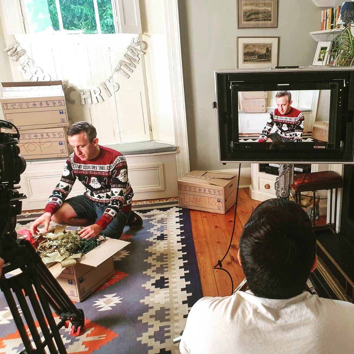 man opening christmas present for video ad