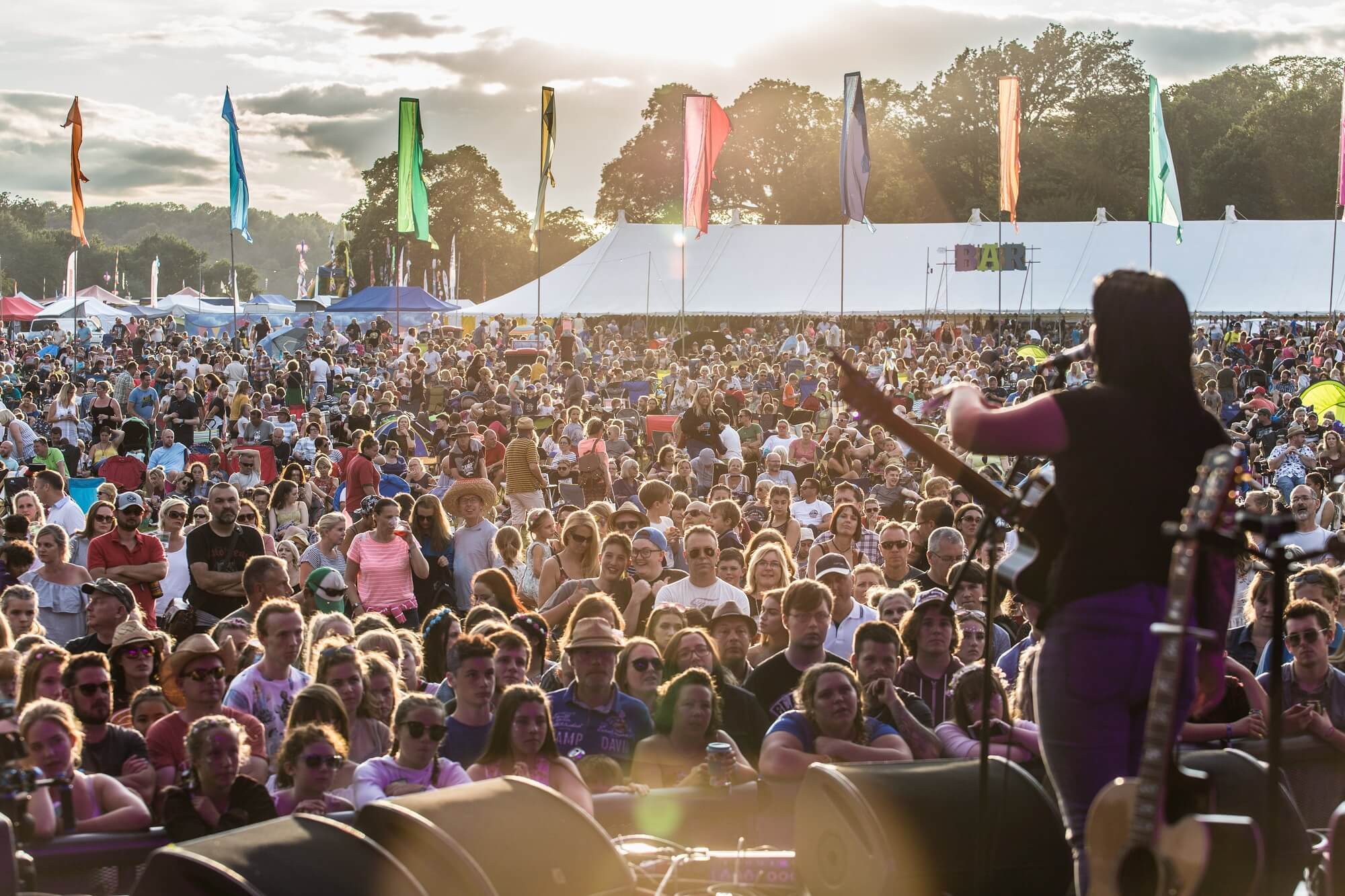 singer on stage at a music festival